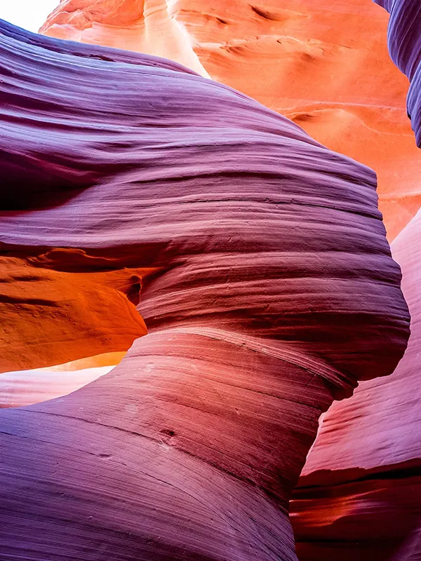 Violet light in a Navajo slot canyon formation called Lady in the Wind, Arizona